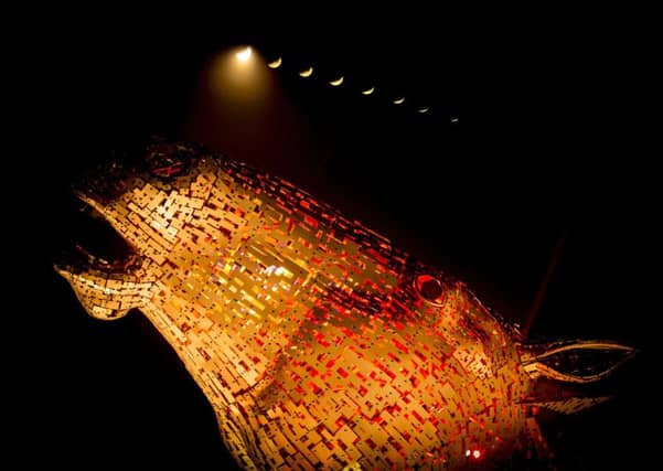 A multiple exposure of the lunar eclipse above the Kelpies. Picture: PA