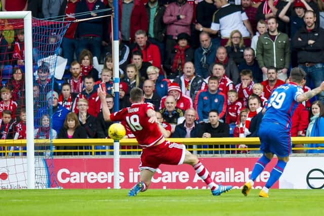 Miles Storey scores the opening goal. Picture: SNS