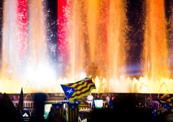 People wave their 'estelades' during the 'Junts pel Si' (Together for the Yes) coalition closing rally in Barcelona. Picture: Getty Images