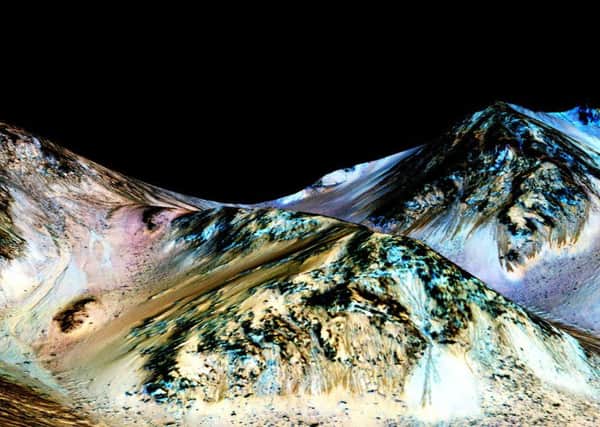 An  image issued by NASA of Mars, which scientists believe is flowing liquid.
Picture: NASA/JPL/University of Arizona