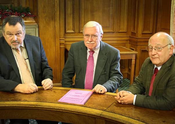 Council Leader Bill McIntosh (centre) with Councillor Robin Reid and depute council leader John McDowall sign off South Ayrshire Council's Budget for 2014/15.