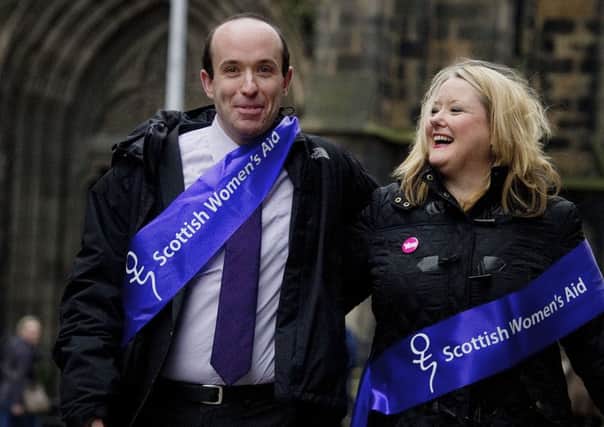 Christine McKelvie takes part in an anti-violence event in Edinburgh with Marco Biagi