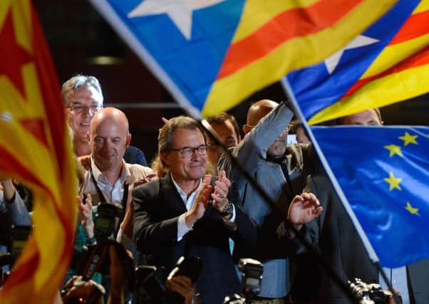 President of Catalonia Artur Mas celebrates as the Catalanist coalition 'Junts Pel Si' (Together for the Yes) claim victory in the regional elections held in Catalonia on Sunday.