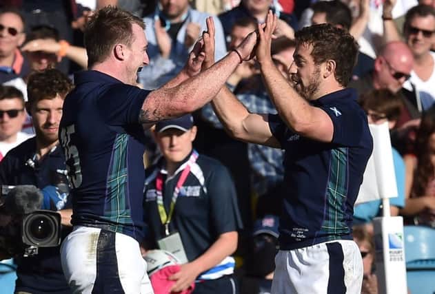 Scotland full-back Stuart Hogg, left, and scrum-half Greig Laidlaw celebrate the win over USA. Picture: AFP/Getty