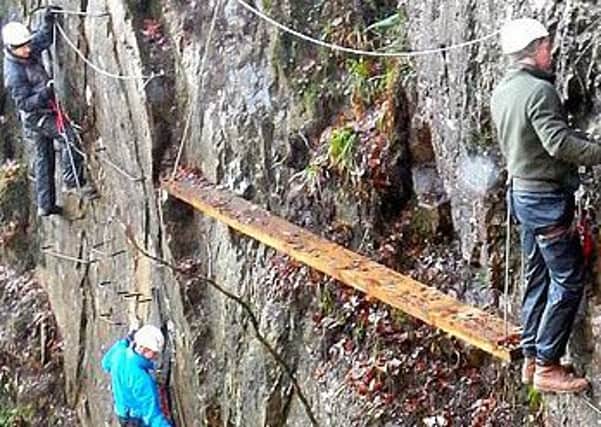 Office workers test trust and problem solving with some Via Ferrata