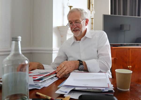 Labour Party Leader Jeremy Corbyn prepares for his first leader's speech in his hotel room in Brighton. Picture: PA