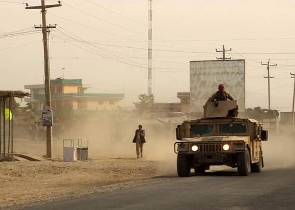 Afghan security forces travel in a Humvee as battles were ongoing between Taliban militants and Afghan security forces  in Kunduz. Picture: AFP/Getty Images