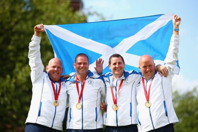 David Peacock, Neil Speirs, Paul Foster, and Alex Marshall of Scotland celebrate with their gold medals at last year's Commonwealth Games. Picture: Getty Images