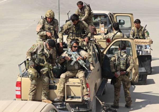 Afghan special forces arrive at the airport as they launch a counteroffensive to retake Kunduz. Picture:AFP/Getty Images