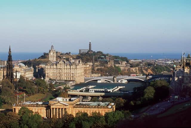 A view of Edinburgh City Centre taken from the Castle, showing Calton Hill, The Scott Monument, The Balmoral Hotel and Waverley Station.