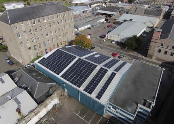 An East/West 100kW roof-top solar array installed by Forster Energy on a warehouse in Dundee for Dundee Industrial Association.