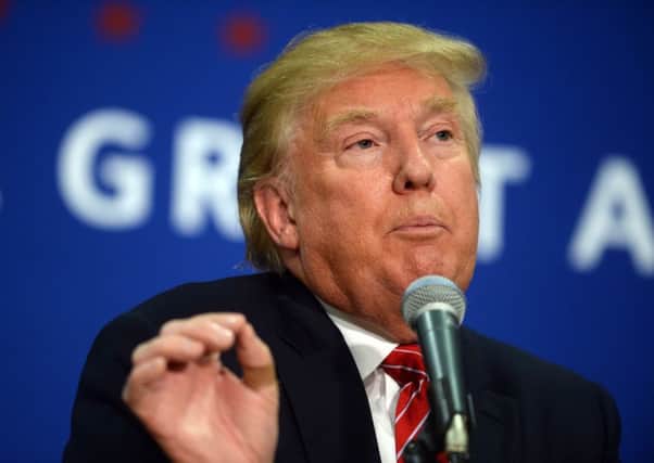 Republican frontrunner Donald Trump speaks at a town hall event in New Hampshire earlier this week. Hes still ahead in the states latest opinion polls but his lead has been cut. Picture: Getty Images