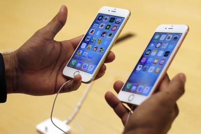 A customer tries out the new Apple iPhone 6s at an Apple store. Picture: AP