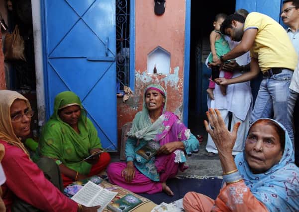 Relatives mourn the killing of 52-year-old Muslim farmer Mohammad Akhlaq at his home in Bisara. Picture: AP