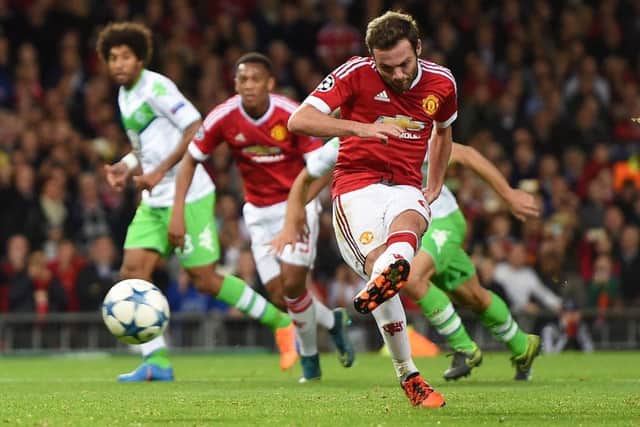 Manchester Uniteds Juan Mata scores his sides first goal from the penalty spot at Old Trafford. Picture: PA