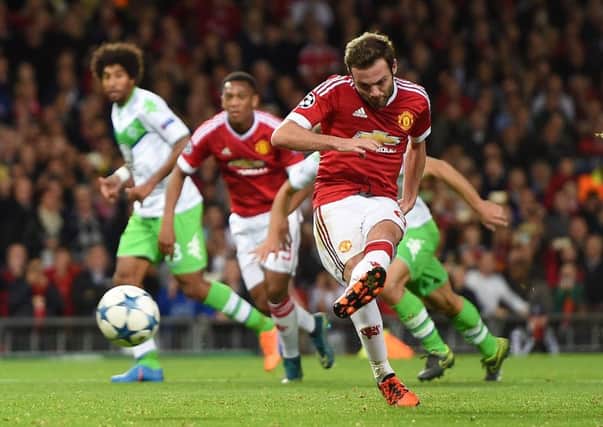 Manchester Uniteds Juan Mata scores his sides first goal from the penalty spot at Old Trafford. Picture: PA