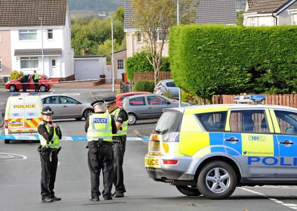 Police at the scene of the shooting last week. Two schools are nearby and pupils were leaving for the day as shots were fired. Picture: Paul McSherry