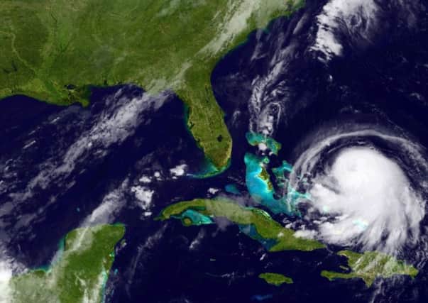 A satellite image shows the storm nearing the Bahamas, with the threat of storm surges, coastal flooding and up to 10 inches of rain. Picture: Getty Images