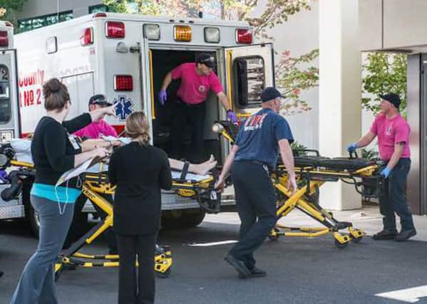 A patient is wheeled into Mercy Medical Center in Roseburg, Oregon. Picture: AP