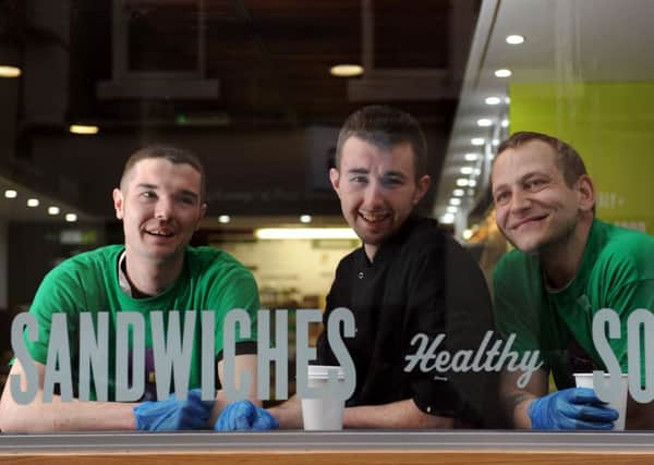 Three homeless collegues who work in the kitchen.
Picture: Lesley Martin