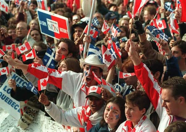 Supporters of a No vote in Quebecs 1995 independence referendum campaign take part in a rally in Montreal. Picture: AFP/Getty Images