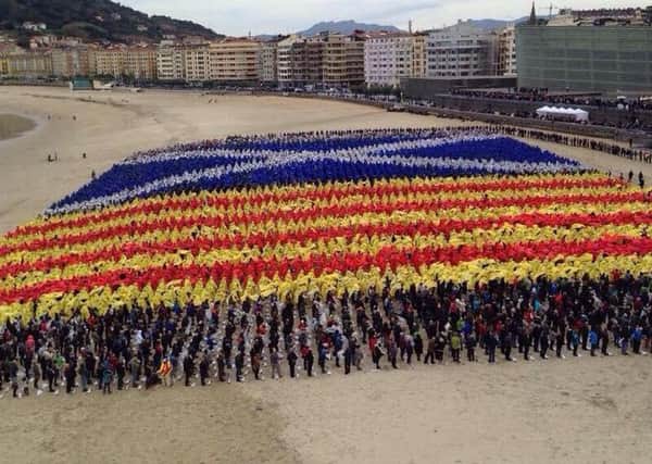 Supporters of Scottish , Basque and Catalan independence on the beach at Donostia / San Sebastian, Basque Country 8 November 2014