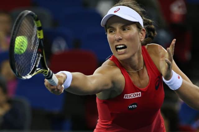 Johanna Konta returns to Venus Williams during their quarter-final clash. Picture: Getty Images