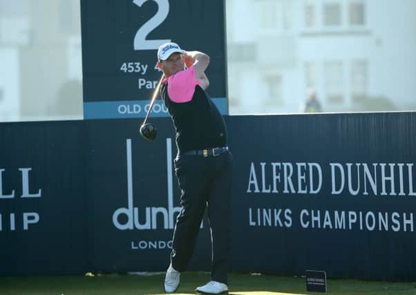 David Drysdale tees off at the second tee on the Old Course at St Andrews yesterday. Picture: Getty Images