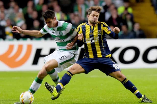 Nir Bitton (left) battles with Fenerbahce's Diego. Picture: SNS Group