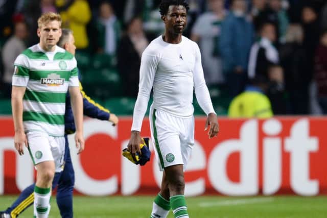 Celtic defender Efe Ambrose walks off dejected at full-time after his side drew with Fenerbahce. Picture: SNS Group