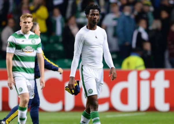 Celtic defender Efe Ambrose walks off dejected at full-time after his side drew with Fenerbahce. Picture: SNS Group