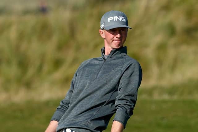 Jimmy Mullen reacts after putting on to the 17th green at the Old Course on his way to a 69. Picture: Getty