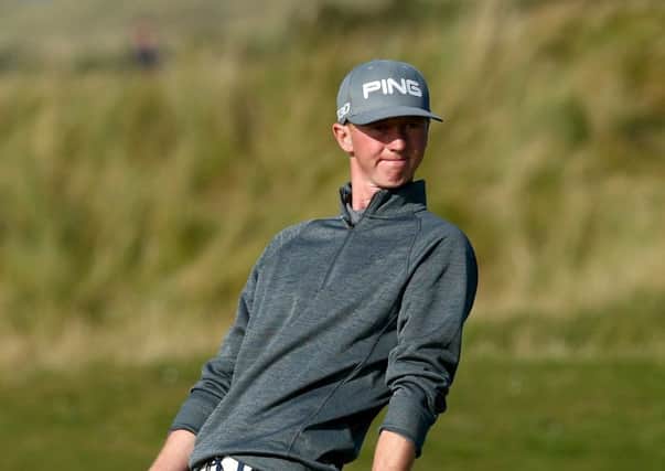 Jimmy Mullen reacts after putting on to the 17th green at the Old Course on his way to a 69. Picture: Getty