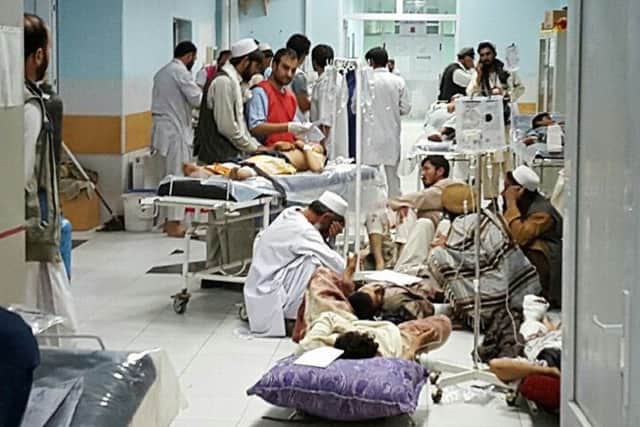 Afghan MSF medical personnel treat civilians at the MSF hospital in Kunduz. Picture: Getty