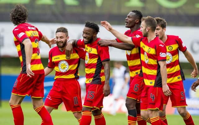 Partick Thistle's Mustapha Dumbuya, centre, celebrates his goal. Picture: SNS