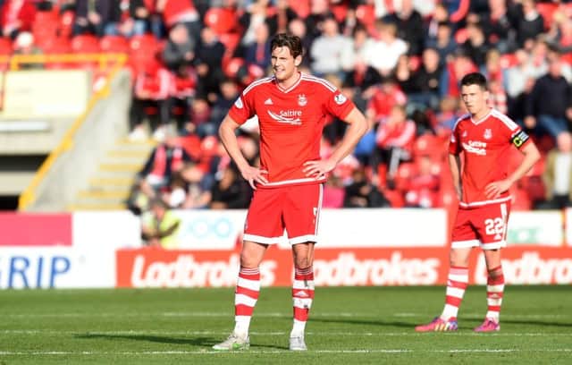 Aberdeen's Ash Taylor, left, and Ryan Jack stand dejected. Picture: SNS