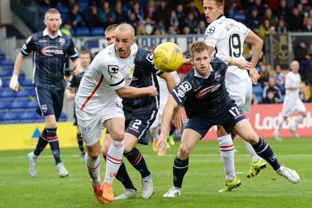 Inverness' James Vincent battles for the ball with Jonathan Franks. Picture: SNS