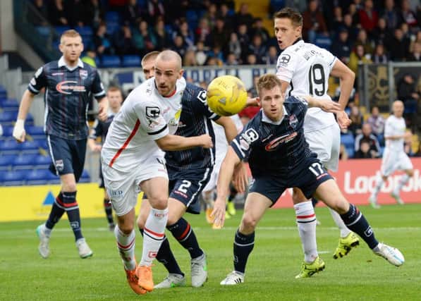 Inverness' James Vincent battles for the ball with Jonathan Franks. Picture: SNS