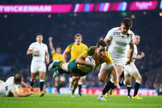 Bernard Foley goes over for Australia's second try. Picture: Getty