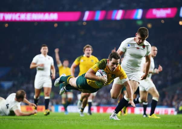 Bernard Foley goes over for Australia's second try. Picture: Getty