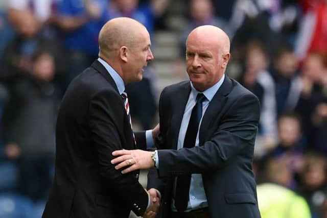 Rangers manager Mark Warburton (left) and Falkirk manager Peter Houston shakes hand at full-time. Picture: SNS