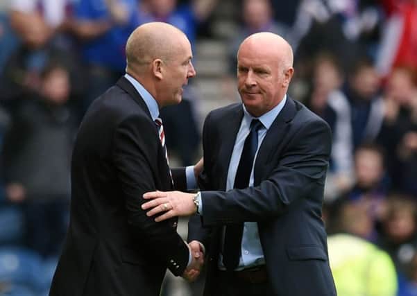 Rangers manager Mark Warburton (left) and Falkirk manager Peter Houston shakes hand at full-time. Picture: SNS