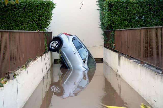 A car in Mandelieu-la-Napoule, southeastern France, after violent storms and flooding. Picture: AFP/Getty