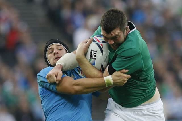 Peter OMahony drives past Italys Michele Campagnaro. Picture: AP