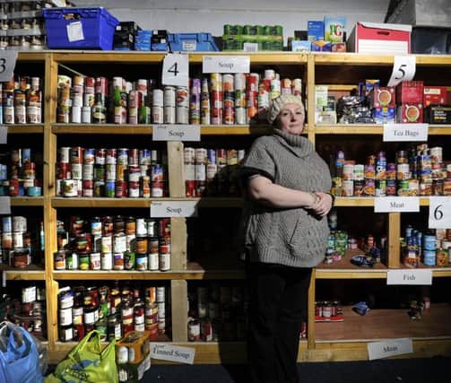 People have been driven to foodbanks like this one despite the so-called living wage. Picture: John Devlin