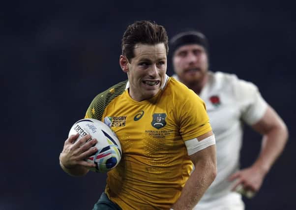 Australian stand-off Bernard Foley runs in for his second try against England. Picture: Getty