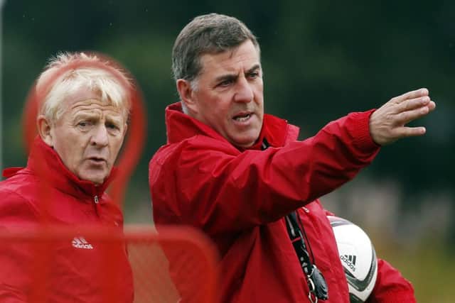 Scotland assistant manager Mark McGhee points the way for his boss Gordon Strachan during a training session yesterday . Picture: PA