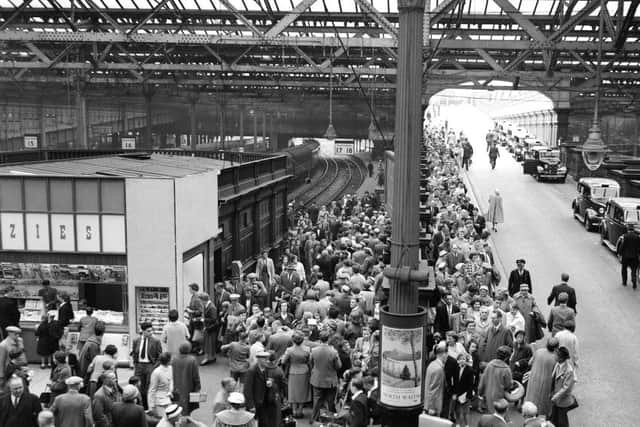 Holiday makers queue at Waverley Station