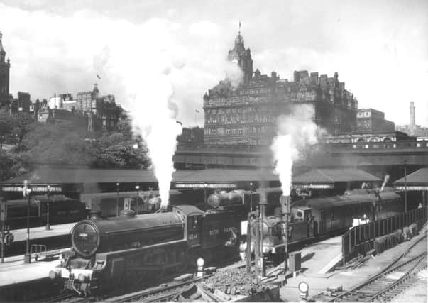 Steam trains at Waverley Station with Waverley bridge and  North British Hotel (now the Balmoral )in the background