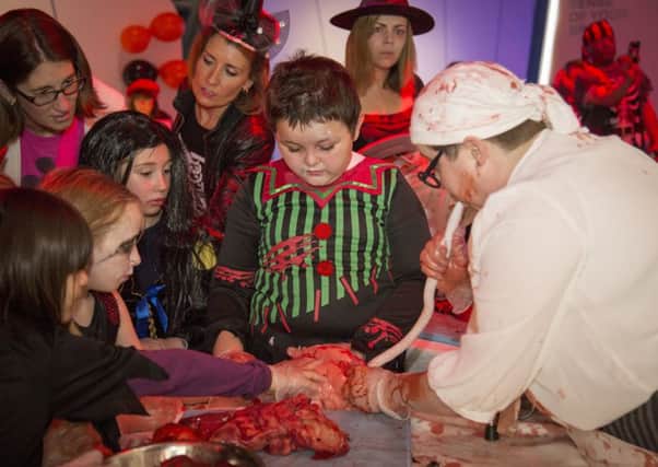 Kids enjoy a gruesome demonstration at the Glasgow Science Centre's Halloween party last year. Picture: Glasgow Science Centre